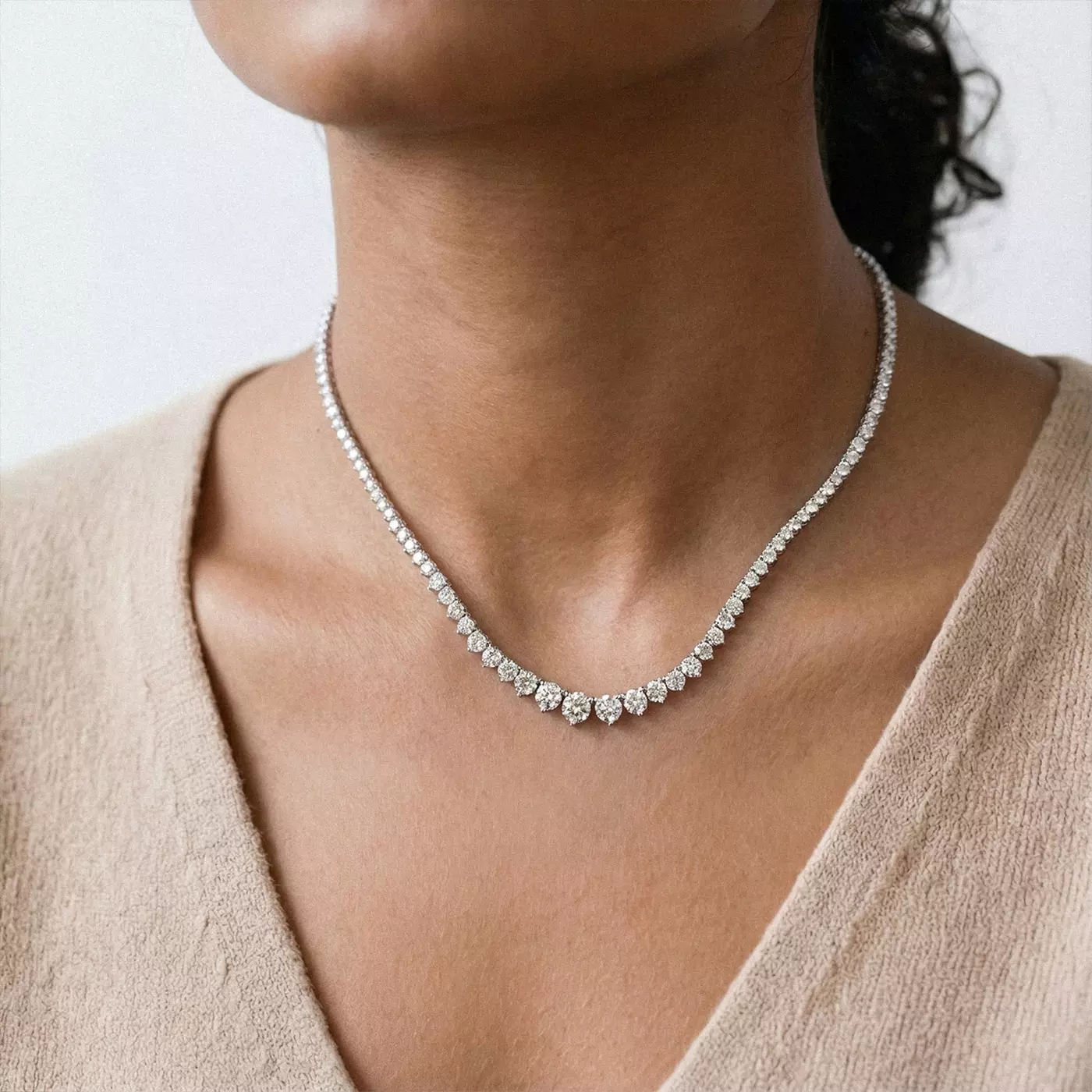 Round Lab Diamond Graduated Riviera Necklace, resting gracefully against the collarbone of the woman wearing it